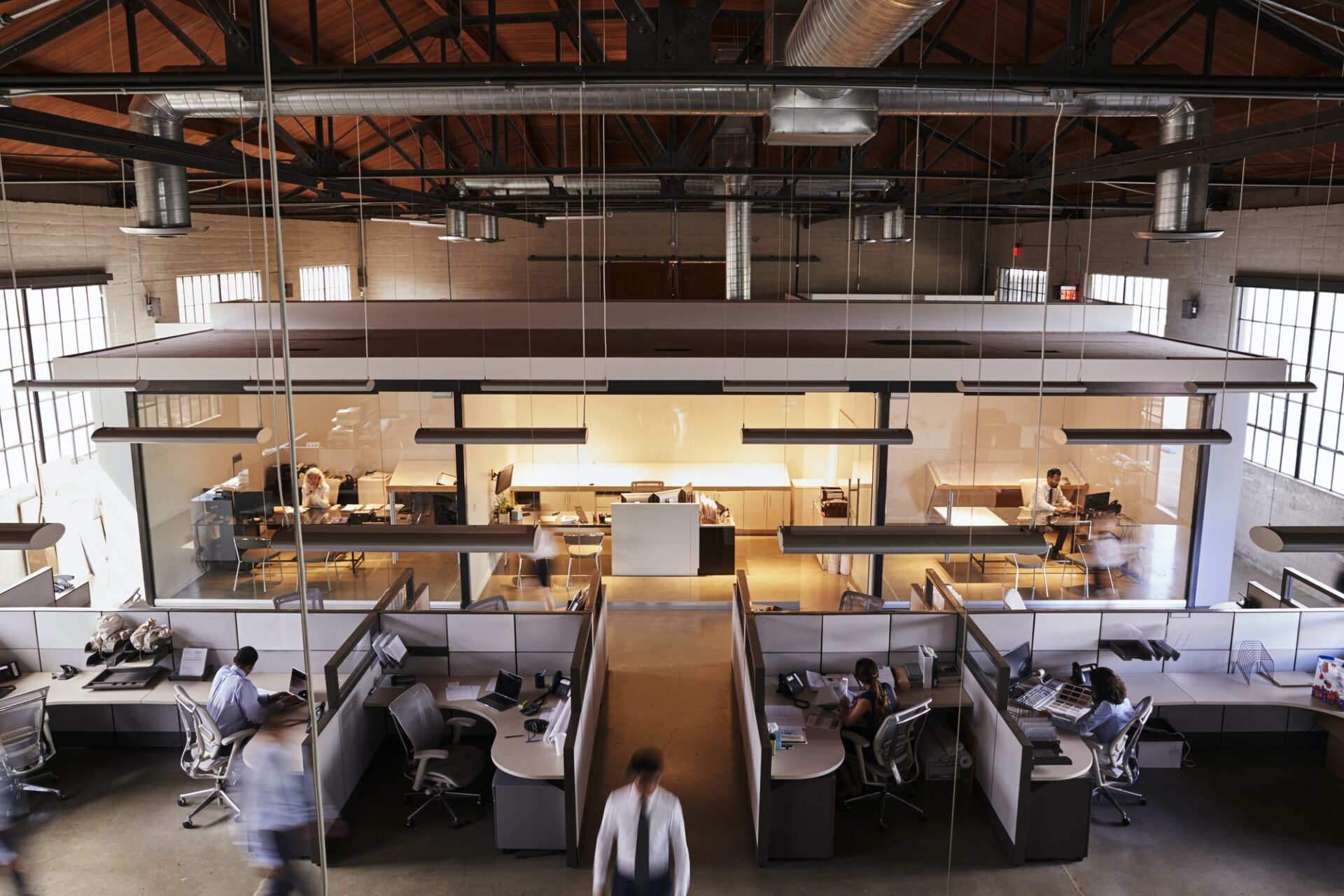 Elevated view of staff working in a busy open plan office